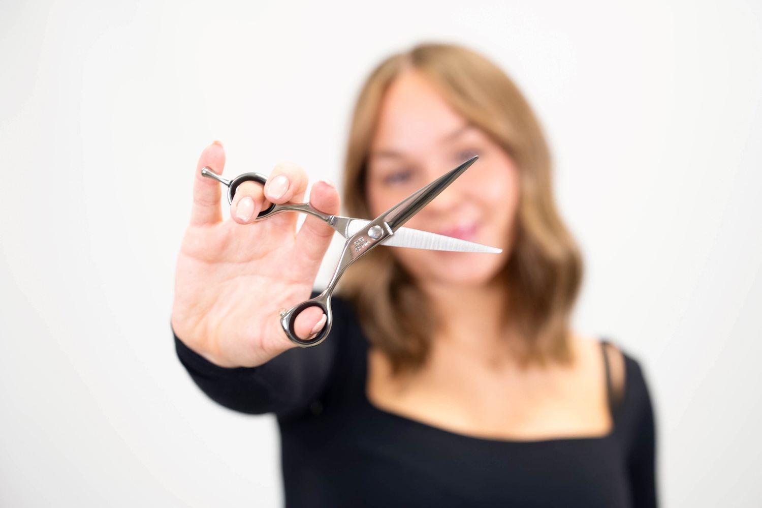 Close-up of haircutting shears in use