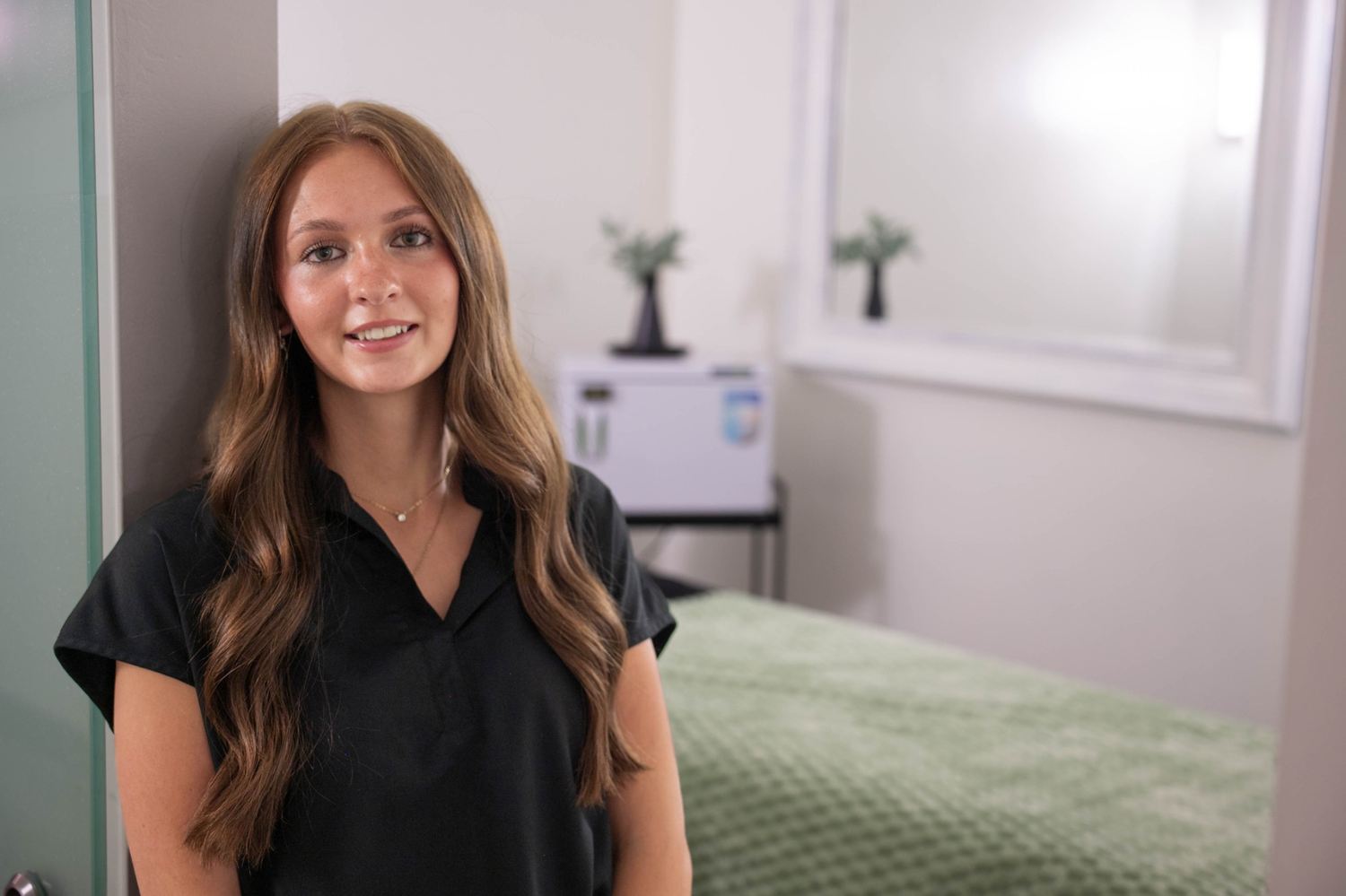 Portrait beside treatment bed